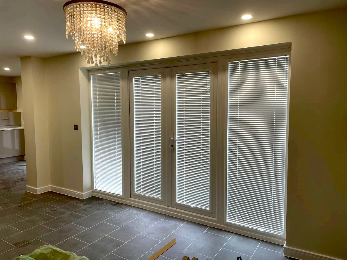 living-room-cream-painted-walls-bifold-doors-chandelier-newport-orchid-decor living room cream painted walls bifold doors chandelier newport orchid decor