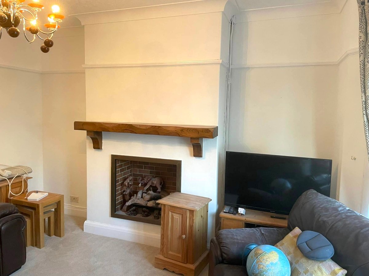 living room cream painted walls brick fireplace newport orchid decor