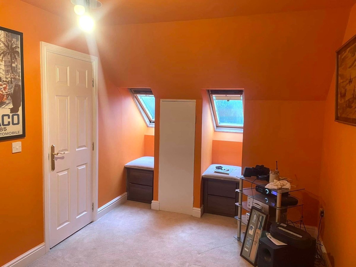 loft bedroom orange painted walls ceiling skylights newport orchid decor
