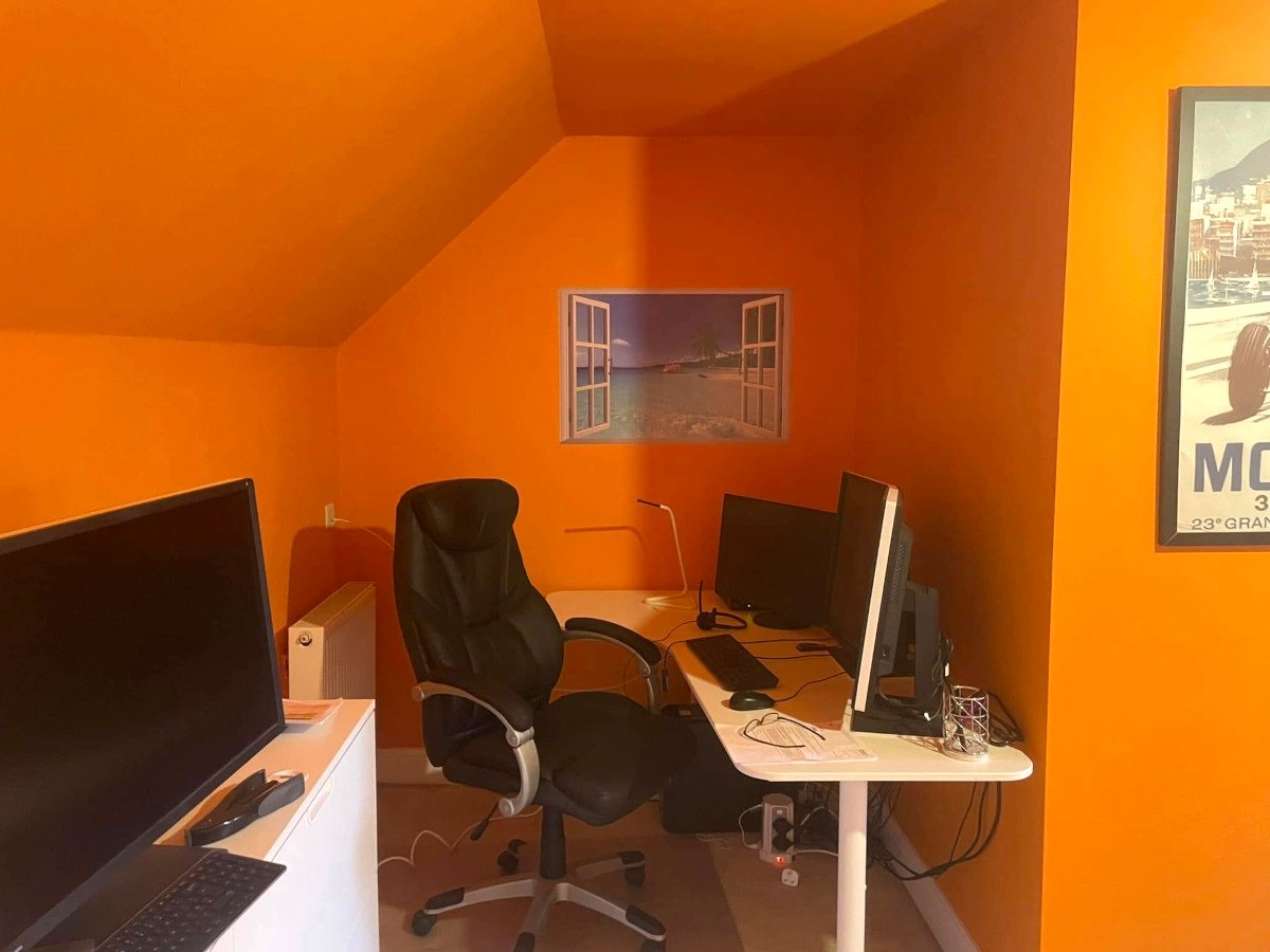 loft office orange painted walls ceiling desks newport orchid decor